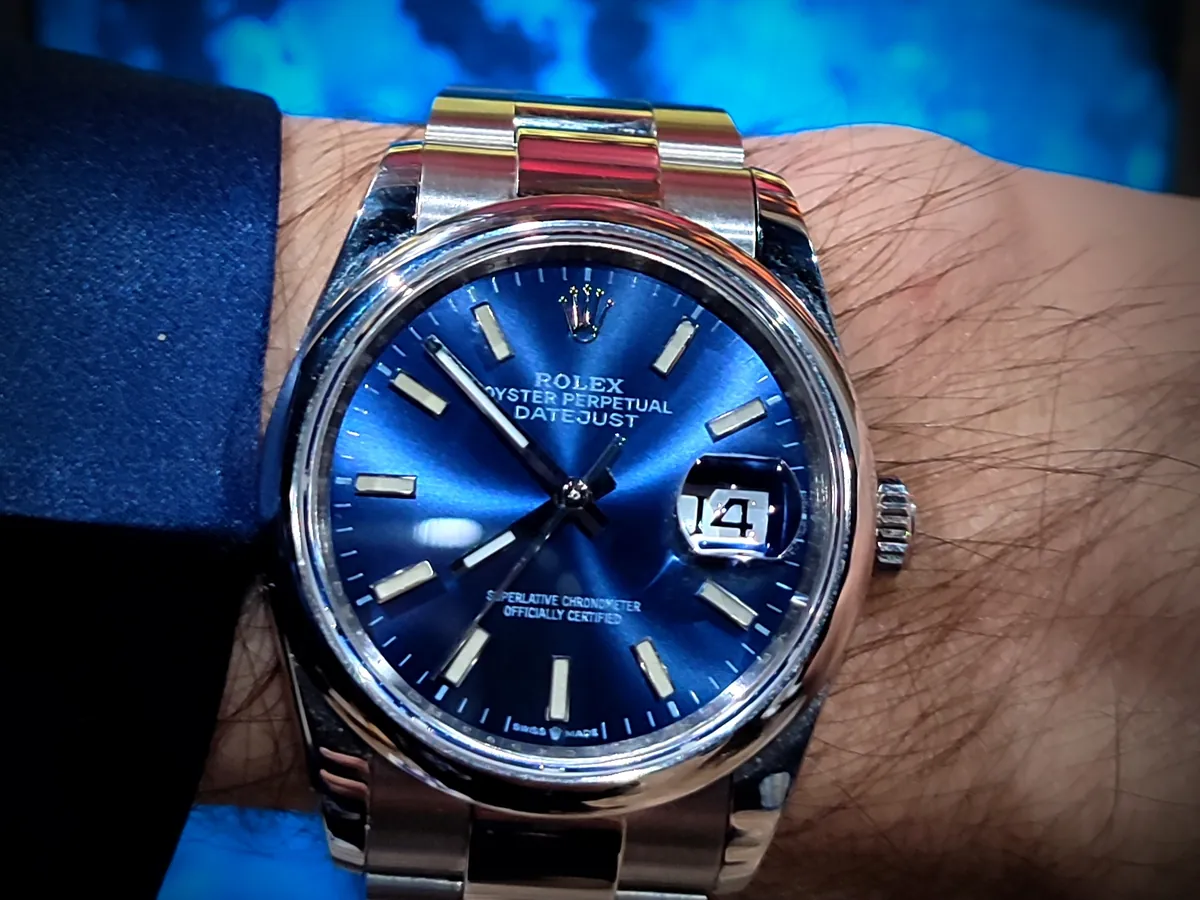 Rolex model comparisons often start here: a Datejust 36 126200 with blue dial on an Oyster bracelet